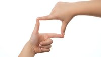 Female hands forming rectangular frame gesture on white background isolated for creative framing concepts and visual communication designs.