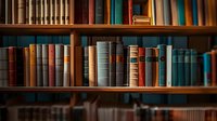 Vintage hardcover books arranged on wooden library shelves, with rich brown, blue and turquoise spines creating atmospheric academic ambiance. Focus on classic literature.