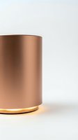 Elegant rose gold cylindrical container with illuminated golden base ring on white background, suitable for luxury product packaging and cosmetic branding designs.