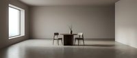 Minimalist dining room with concrete floor, neutral walls, and modern furniture arrangement near window with natural light.