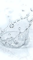 Dynamic water splash with droplets and waves frozen in motion against white background, suitable for beverage, wellness, and hydration product marketing.