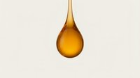 Golden honey drop falling isolated on light background for natural sweetness and organic food concepts.