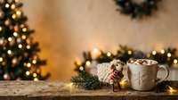 Cozy winter scene with steaming mug of hot chocolate, candy cane, knitted sweater, evergreen branches and glowing Christmas tree lights on wooden surface for holiday seasonal content.