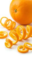Fresh orange with curled citrus peel zest spiral on white background, showcasing vibrant color and texture for food and beverage concepts.