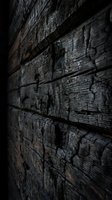 Charred wooden planks with deep cracks and burn marks creating dramatic texture and shadow patterns on weathered timber surface.
