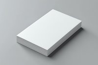 Stack of blank white paper sheets on gray background, isolated mockup for business cards, flyers and corporate identity design presentation.