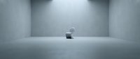 Empty concrete gallery space with single spotlight illuminating minimalist architectural interior for contemporary art exhibitions and modern design concepts.