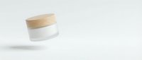 Minimalist cosmetic jar with wooden lid floating on clean white background for skincare and beauty product packaging design.