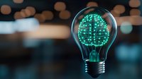 Glowing green digital brain inside light bulb on dark background with bokeh lights, representing artificial intelligence and innovative technology solutions.