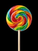 Colorful spiral lollipop with red, yellow, orange, green, and blue swirls on wooden stick, isolated on transparent background. Ready for t-shirt designs, stickers, clipart, and print-on-demand products.