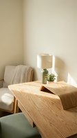 Modern minimalist living room interior with wooden coffee table, beige armchair, ceramic lamp and green plant in warm natural lighting for home decor.