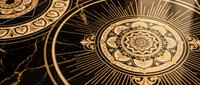 Ornate golden mandala designs with intricate geometric patterns and radiating sunburst elements on dark background for spiritual and decorative projects.