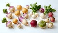 Fresh organic turnips and radishes with green leafy tops arranged on white background, perfect for healthy cooking and farm-to-table recipes.