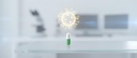 Capsule pill with glowing virus molecule icon floating above laboratory desk with blurred medical equipment and monitors in background for healthcare and pharmaceutical research concepts.