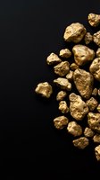 Raw gold nuggets scattered on black background showcasing natural precious metal texture and mining wealth concept for investment designs.