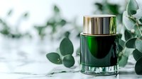 Luxury green glass cosmetic jar with metallic gold cap surrounded by fresh eucalyptus leaves on white marble background, elegant skincare product photography.