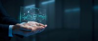 Businessman hand presenting holographic cybersecurity shield with digital data protection interface in futuristic technology environment.
