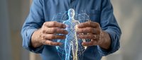 Male healthcare professional in blue shirt holding glowing digital human body hologram, representing medical technology, telemedicine, and healthcare innovation for digital health applications.