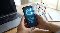 Mobile phone displaying customer attraction magnet concept with floating people icons representing target audience engagement and digital marketing strategy.