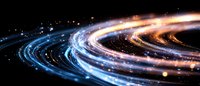 Glowing spiral light trails with blue and orange streaks against dark background create dynamic motion effect for technology and innovation concepts.