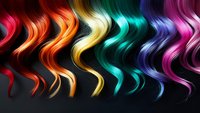Colorful wavy hair strands in rainbow spectrum from red to pink arranged in row on dark background, showing different vibrant hair dye colors and styling options.