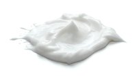 Splashing milk or cream isolated on white background, ready for beverage, dairy product, and food design applications.
