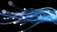 Glowing blue fiber optic strands with light particles flowing through curved lines against dark background create modern technology concept.