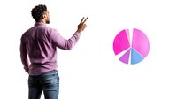 Young African American male in casual attire showing peace sign gesture while standing next to colorful pie chart graphic, representing business analytics and positive attitude.
