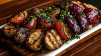 Grilled assorted vegetables including mushrooms, tomatoes, and purple onions garnished with fresh herbs on white serving plate against wooden surface.
