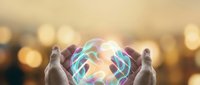 Hands protecting glowing holographic brain with neural networks against warm bokeh background symbolizing mental health care and cognitive protection.