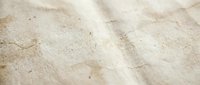 Warm sunlight casting soft shadows across textured sand surface with natural grain patterns and subtle imperfections for beach and summer concepts.