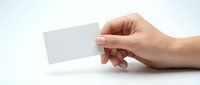 Hand holding blank white business card mockup on clean background for branding and corporate identity design projects.