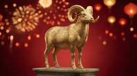 Golden ram statue standing on platform against red festive background with bokeh lights and fireworks, suitable for lunar new year celebrations, prosperity symbols, and holiday design projects.
