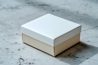 White square gift box with lid on marble surface, elegant minimal packaging design for product presentation, branding mockup or retail display.