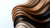 Flowing hair strands in natural brown tones creating elegant waves against white background for beauty and haircare design concepts.