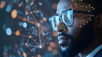 Young African American businessman with glasses surrounded by glowing digital network connections and data visualization elements against dark background with bokeh effect.