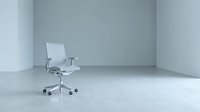 Modern white office chair with mesh back and armrests positioned in empty minimalist room with concrete floor. Suitable for corporate, business, and workspace design projects.