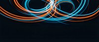 Abstract flowing light trails in orange and blue creating dynamic curved lines and loops on dark background for modern digital design projects.