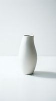 Minimalist white ceramic vase with curved organic form, isolated on neutral background. Modern home decor and interior design element suitable for lifestyle and product photography.