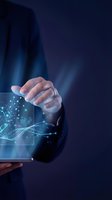 Businessman in dark suit holding transparent tablet with glowing digital network interface, data visualization, and connected nodes for technology, innovation, and business solutions.