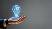 Businessman hand holding glowing neon light bulb with gear mechanism, representing innovation, technology, and creative business solutions for corporate concepts.