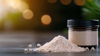 Pink Himalayan salt pile and glass jar on dark surface with bokeh light effect and blurred green background, natural mineral supplement for cooking.