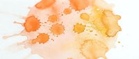 Abstract watercolor splash in warm orange and yellow tones with organic paint drops and splatters on white background for creative design projects.