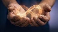 Hands holding glowing infinity symbol representing endless possibilities, eternal concepts, and limitless potential for business and spiritual growth.