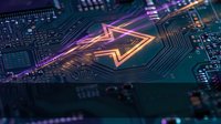 Futuristic circuit board with glowing neon triangular hologram displaying advanced technology and digital innovation for tech presentations and designs.