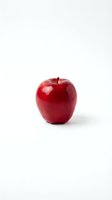 Fresh red apple isolated on white background, ready for health and nutrition design projects, packaging, and educational materials.