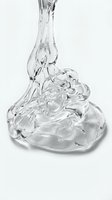 Clear gel or liquid pouring onto glossy surface creating dynamic splash effect. Isolated on white background, suitable for cosmetics, skincare, beauty product packaging, and advertising designs.
