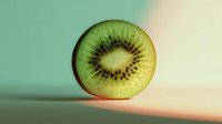 Fresh kiwi fruit slice showing vibrant green flesh and black seeds on gradient background for healthy eating and nutrition concepts.