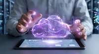 Business professional managing holographic cloud computing technology above digital tablet in modern data center for enterprise solutions.