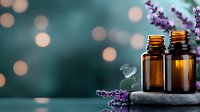 Aromatic lavender sprigs with essential oil bottles on stone surface against blurred bokeh background, creating spa wellness atmosphere with soft lighting.